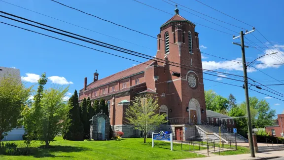 St. Adalbert Church, a brick Catholic church with a tall bell tower, in the Thompsonville section of Enfield, Connecticut