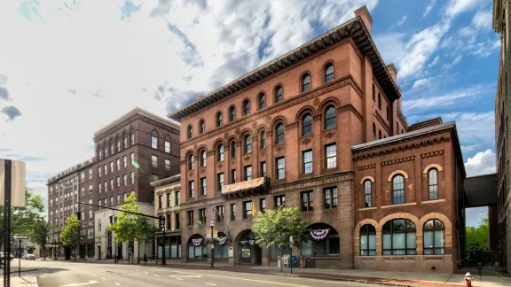 Historic brownstone and brick buildings along West Main Street in downtown New Britain, Connecticut