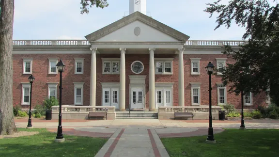 Windsor Town Hall, a brick colonial building with a columned portico and clock cupola, in Windsor, Connecticut